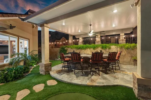 a large white kitchen with a sink and cabinets