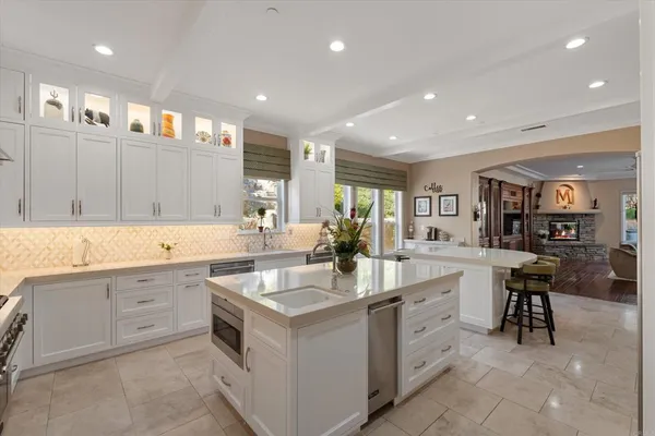 a living room with fireplace furniture and a wooden floor