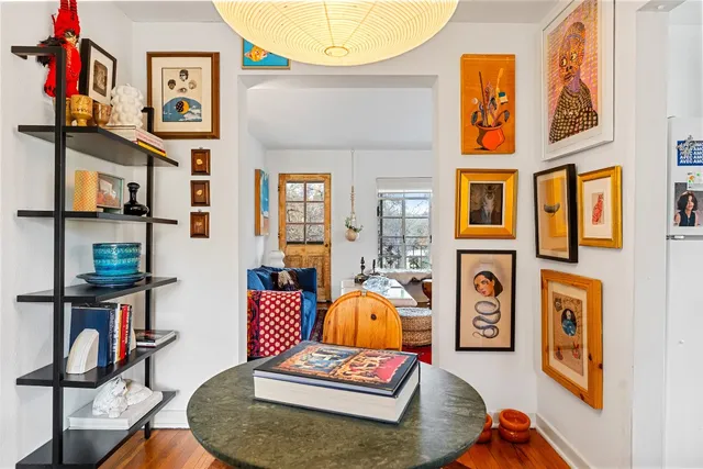 a living room with furniture and a rug