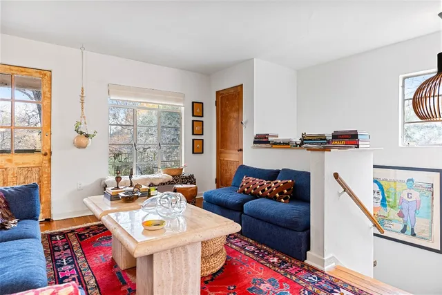 a living room with furniture and a table