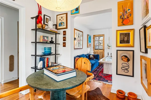 a living room with fireplace furniture and a book shelf