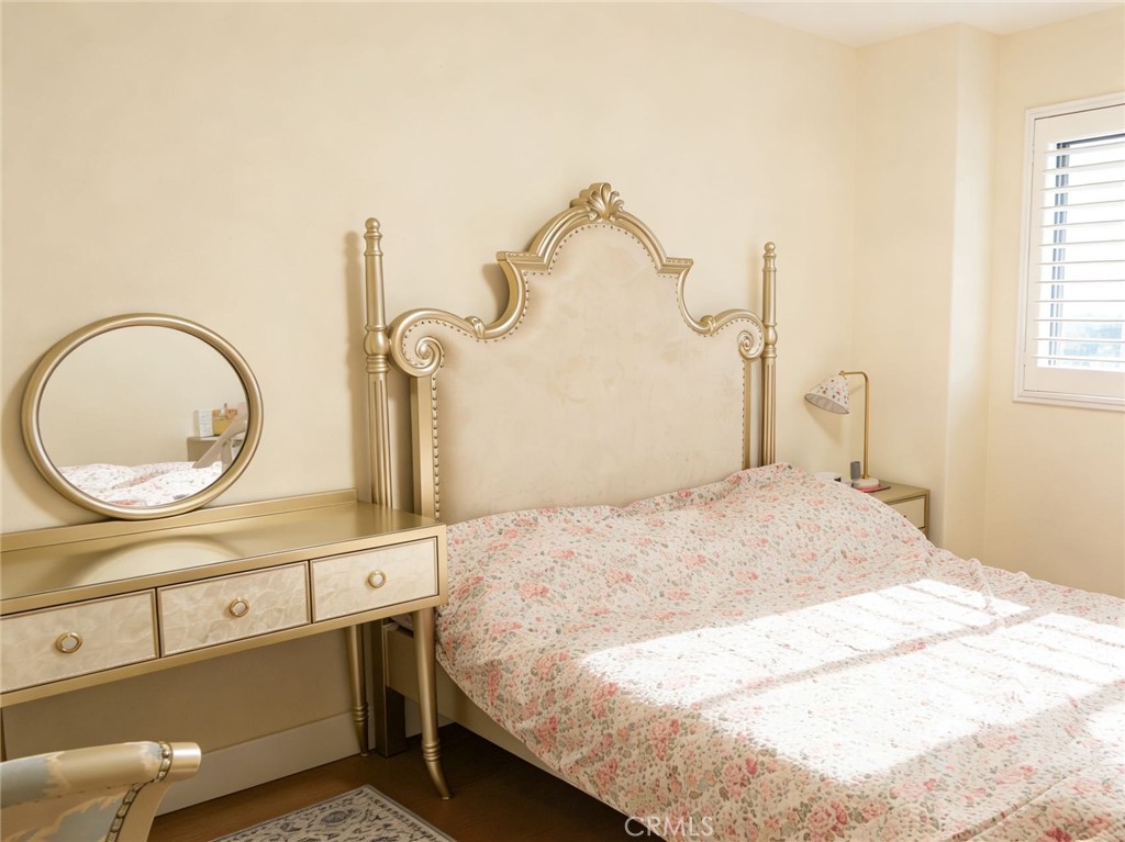 2115 Sun Ridge Drive Chino Hills, CA 91709 - Photo 8 of 9 a bedroom with a bed and a mirror