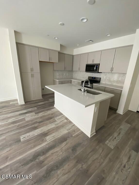 105 Red Brick Drive, Unit 3 Simi Valley, CA 93065 - Photo 5 of 14 a view of kitchen with kitchen island a sink a stove and a refrigerator