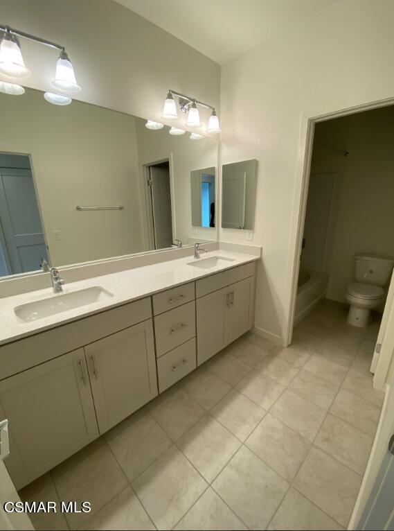 105 Red Brick Drive, Unit 3 Simi Valley, CA 93065 - Photo 9 of 14 a spacious bathroom with a double vanity sink mirror and toilet