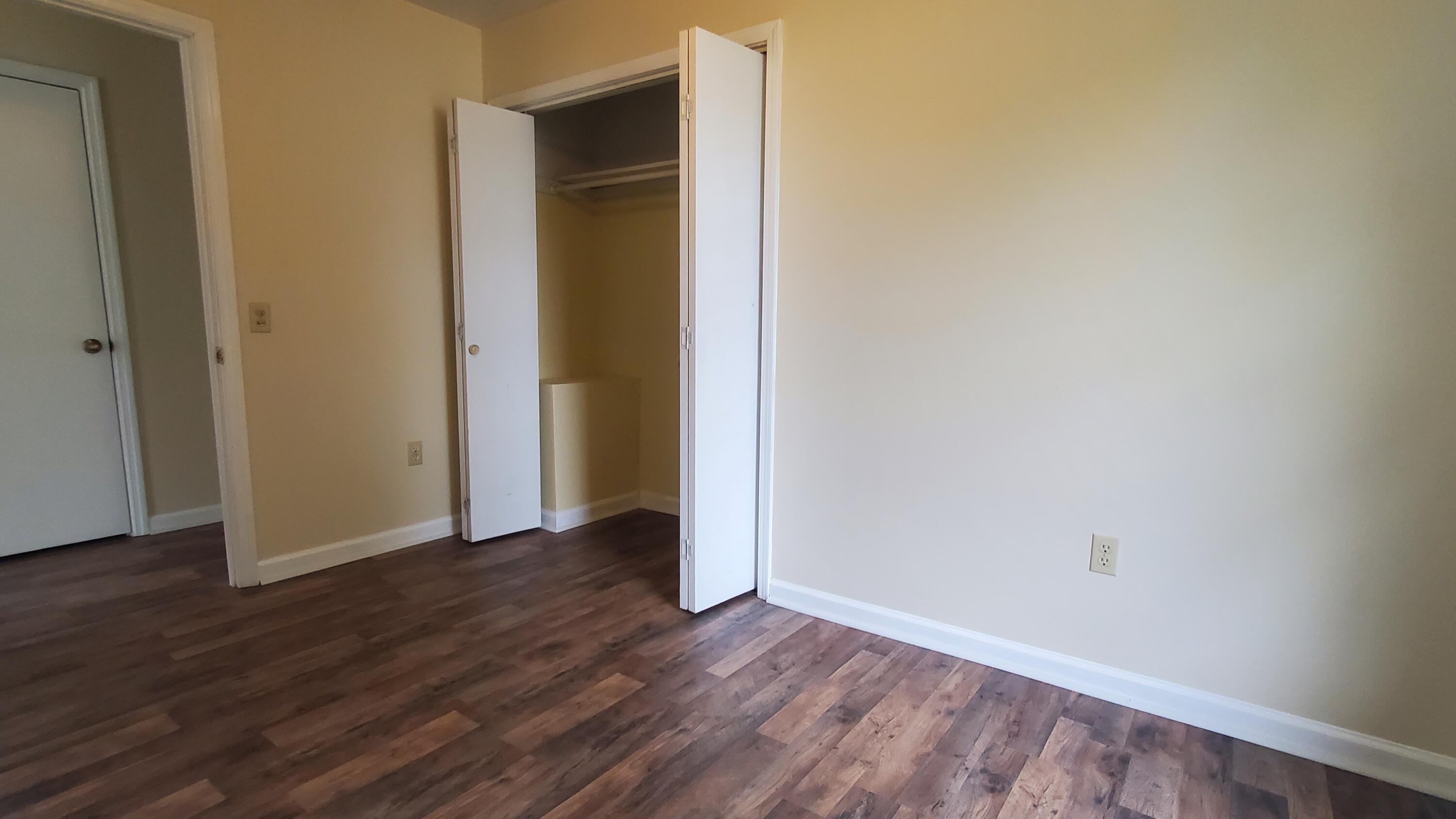 80 Honeywood Road Rocky Mount, VA 24151 - Photo 11 of 18 a view of an empty room with wooden floor and closet