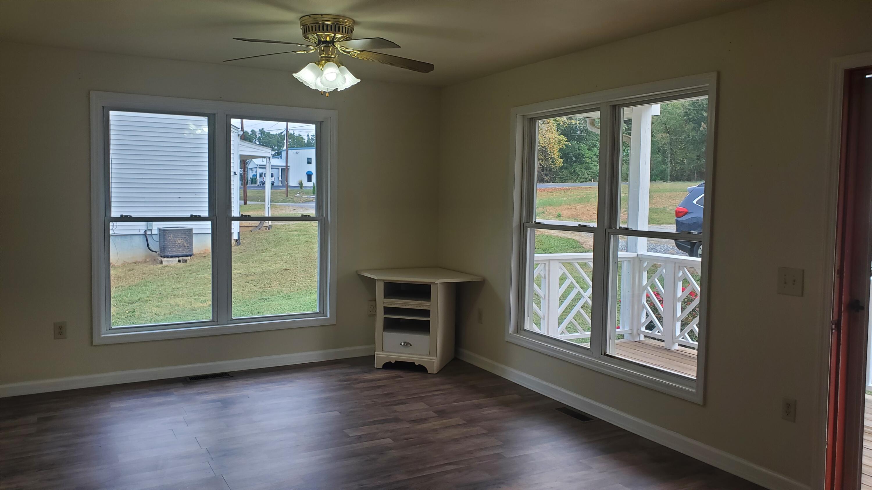 80 Honeywood Road Rocky Mount, VA 24151 - Photo 3 of 18 a view of an empty room with wooden floor and a window