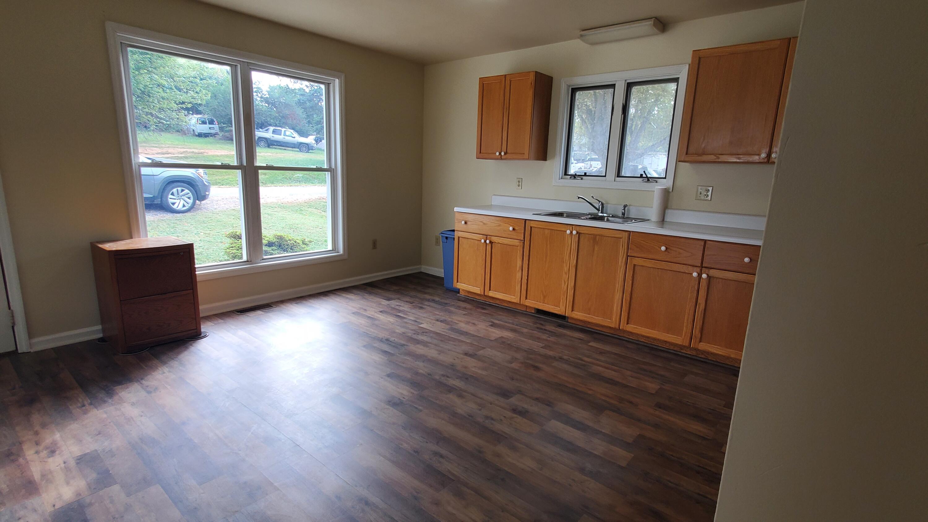 80 Honeywood Road Rocky Mount, VA 24151 - Photo 6 of 18 a view of a kitchen with wooden floor and a window