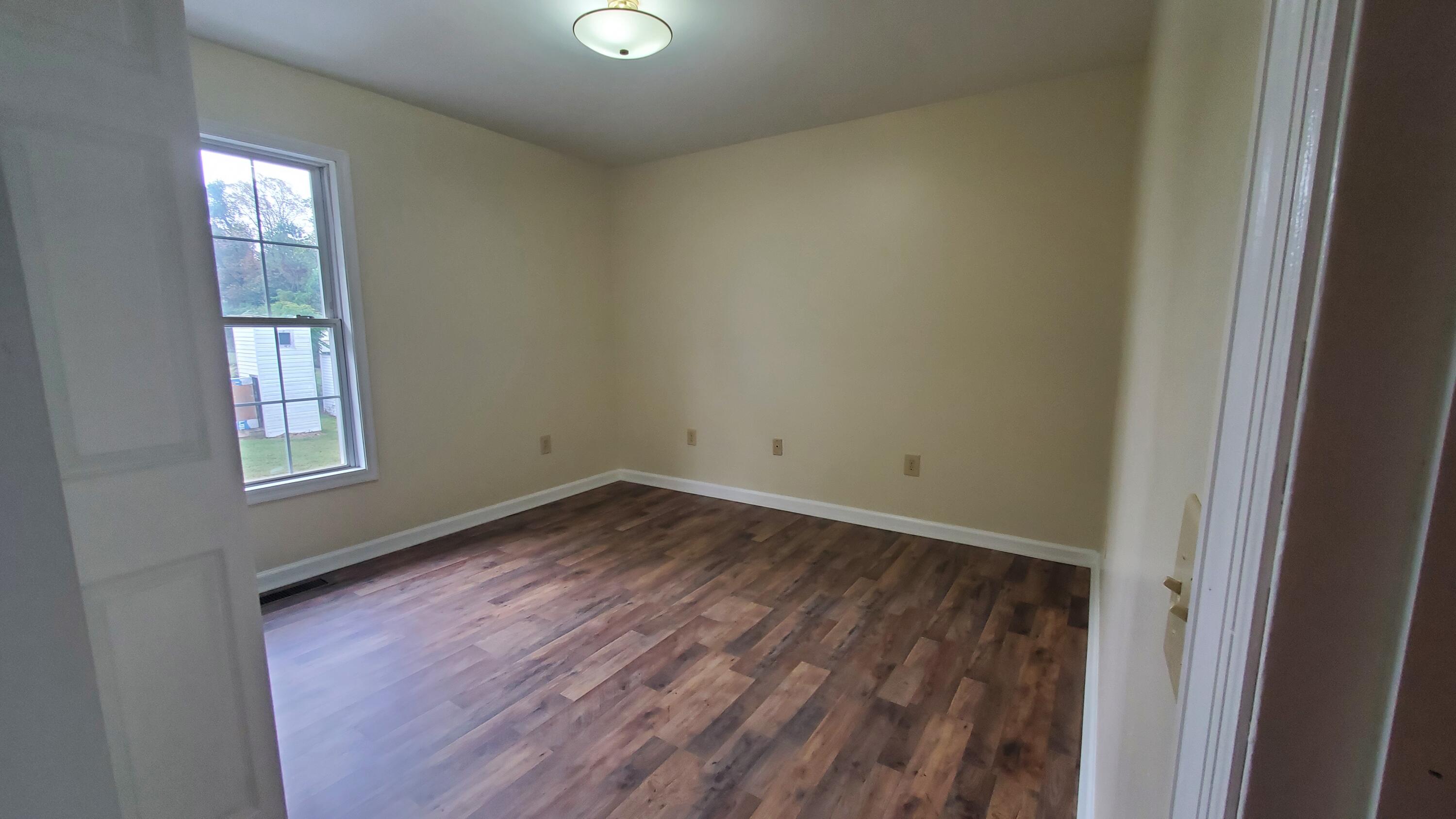 80 Honeywood Road Rocky Mount, VA 24151 - Photo 10 of 18 an empty room with windows
