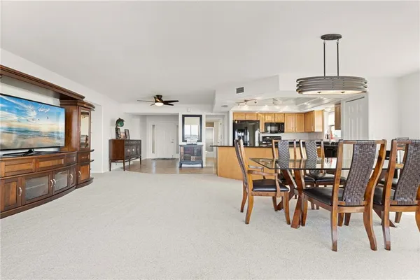 a view of a dining room with furniture window and outside view