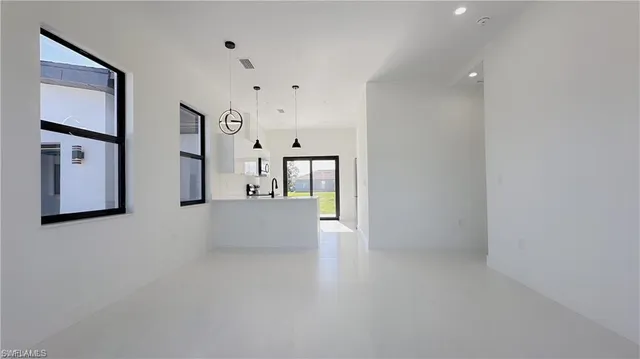 wooden floor with windows and painted walls