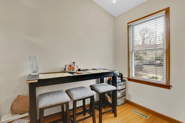a dining room with furniture and window