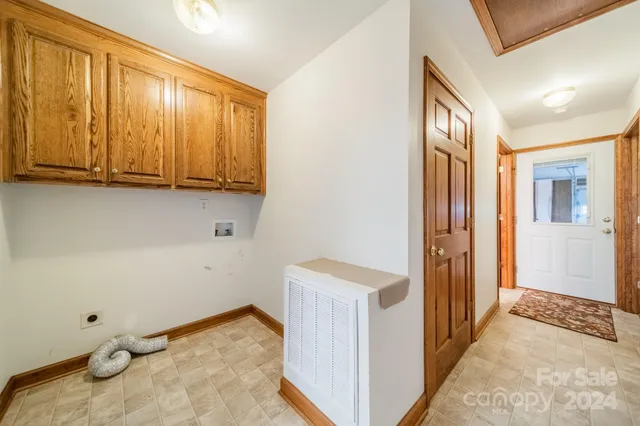 a spacious bathroom with a sink a toilet and shower