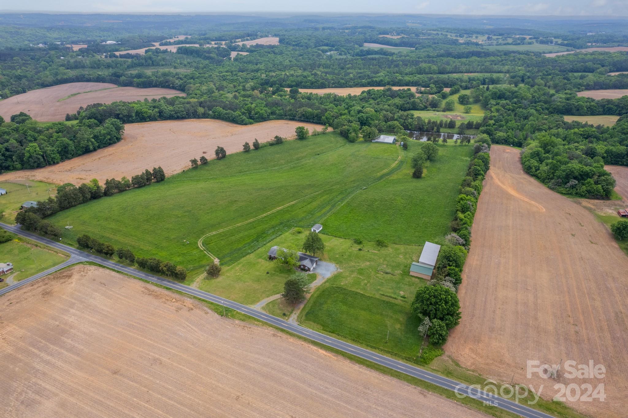 24686 Barbees Grove Road Oakboro, NC 28129 - Photo 27 of 35 an aerial view of a city