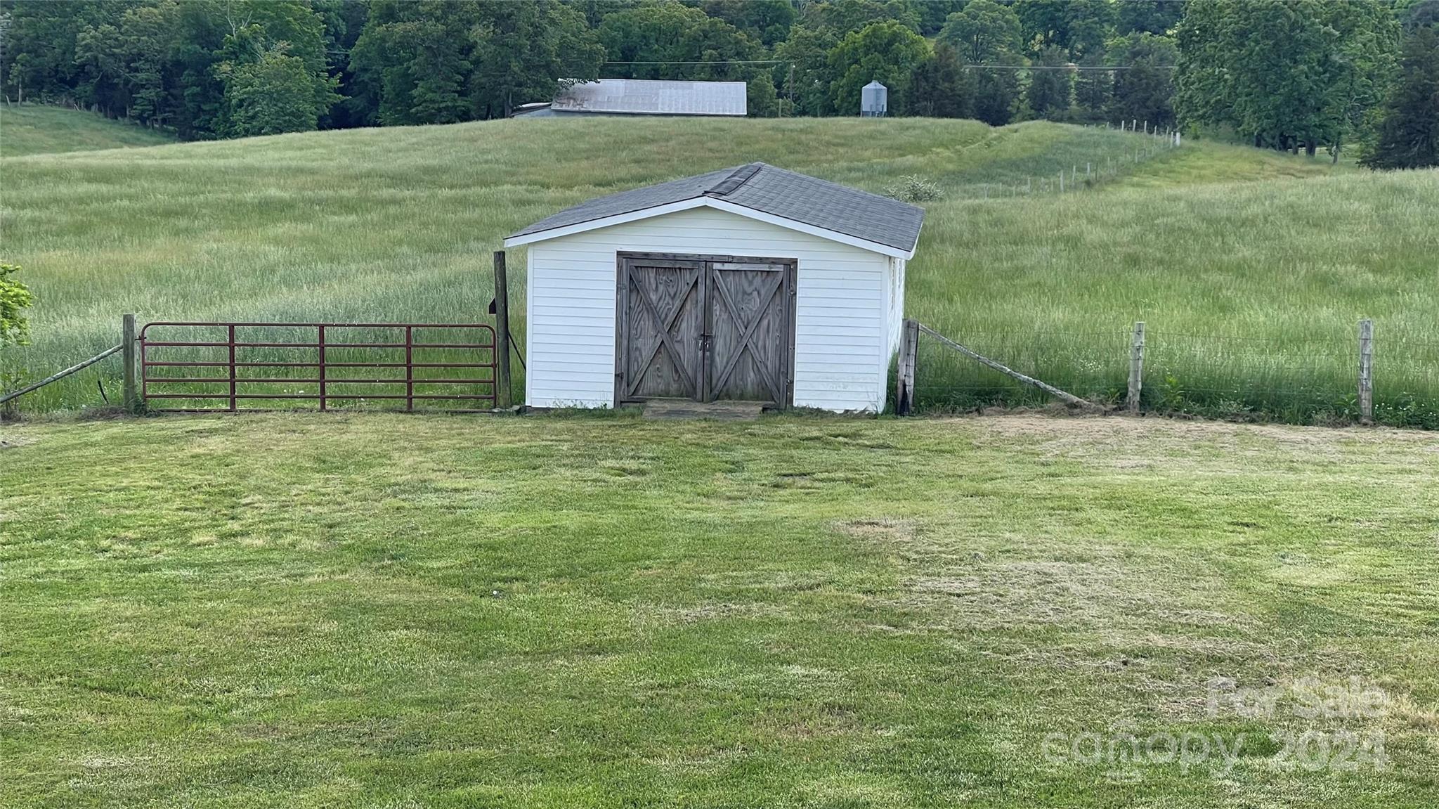 24686 Barbees Grove Road Oakboro, NC 28129 - Photo 32 of 35 a view of a backyard