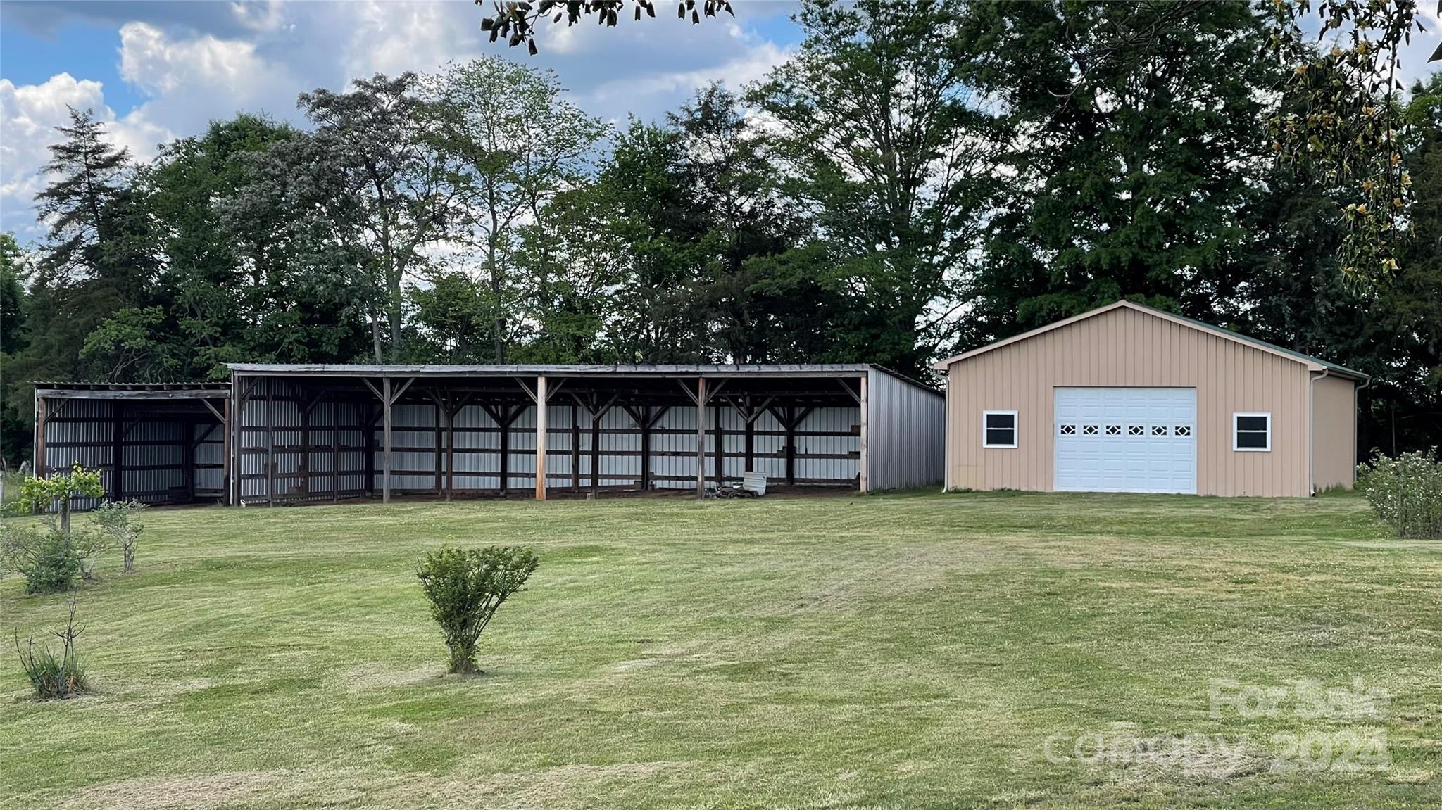 24686 Barbees Grove Road Oakboro, NC 28129 - Photo 35 of 35 a house view with a outdoor space