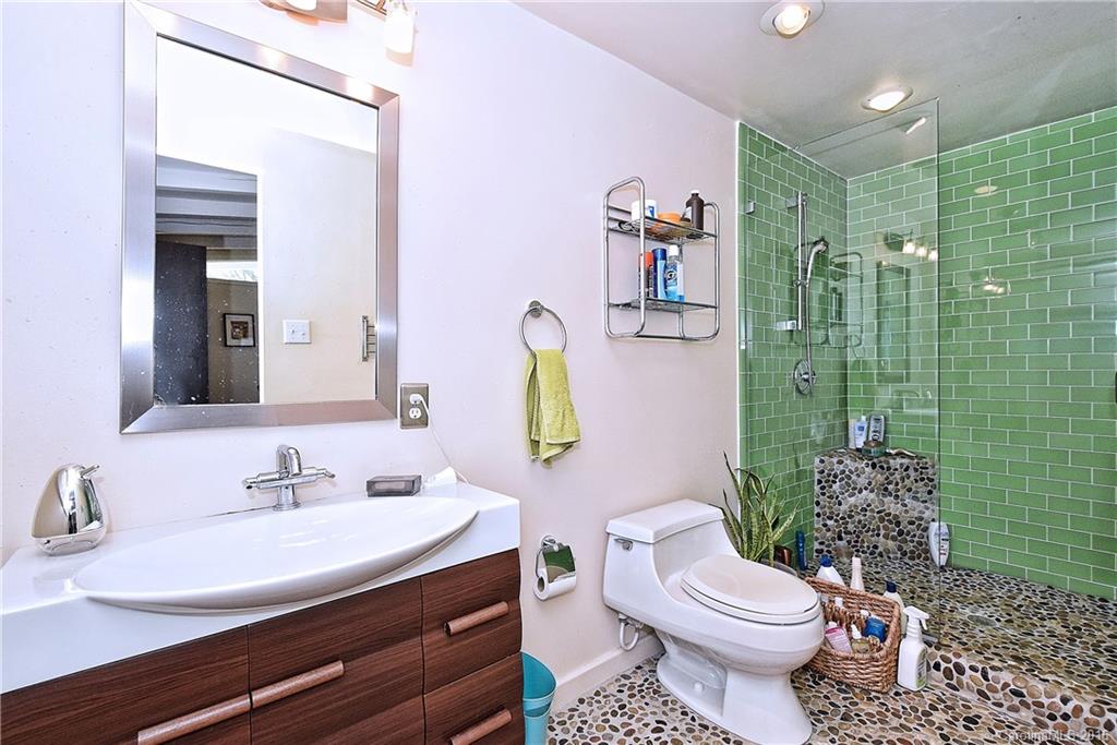 3111 Spring Valley Road Charlotte, NC 28210 - Photo 14 of 24 a bathroom with a sink toilet and shower
