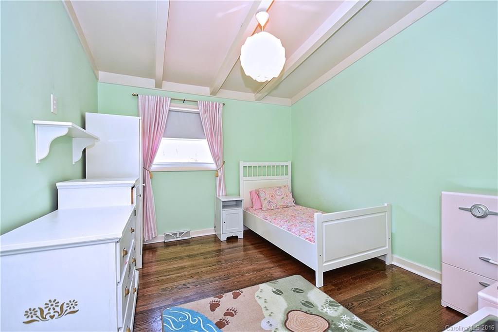3111 Spring Valley Road Charlotte, NC 28210 - Photo 16 of 24 a bedroom with a bed and a dresser