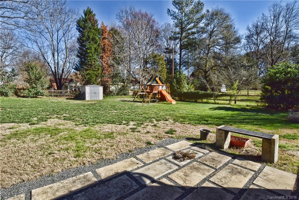 3111 Spring Valley Road Charlotte, NC 28210 - Photo 18 of 24 a view of a bench in a garden