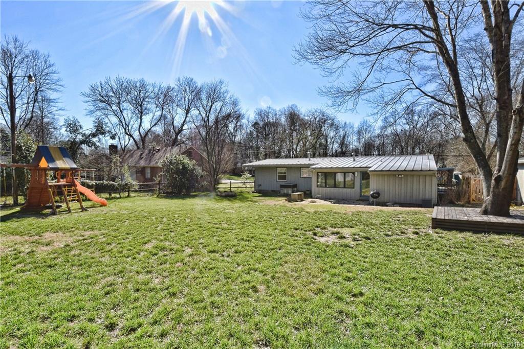 3111 Spring Valley Road Charlotte, NC 28210 - Photo 19 of 24 a front view of a house with a yard
