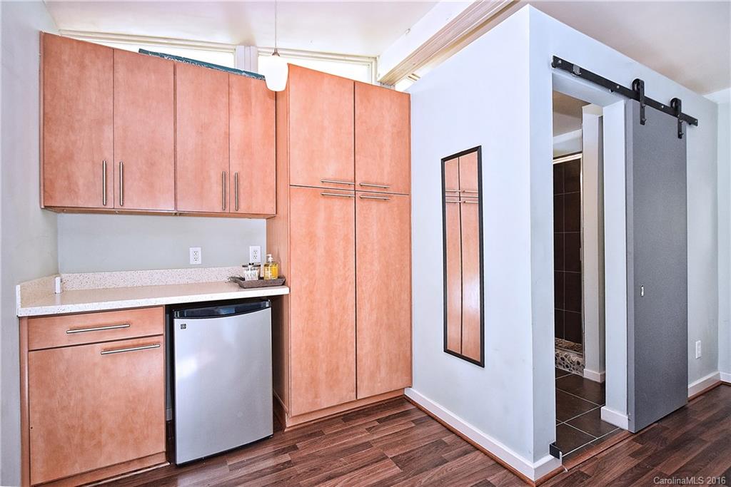 3111 Spring Valley Road Charlotte, NC 28210 - Photo 21 of 24 a kitchen with stainless steel appliances granite countertop a refrigerator and a sink