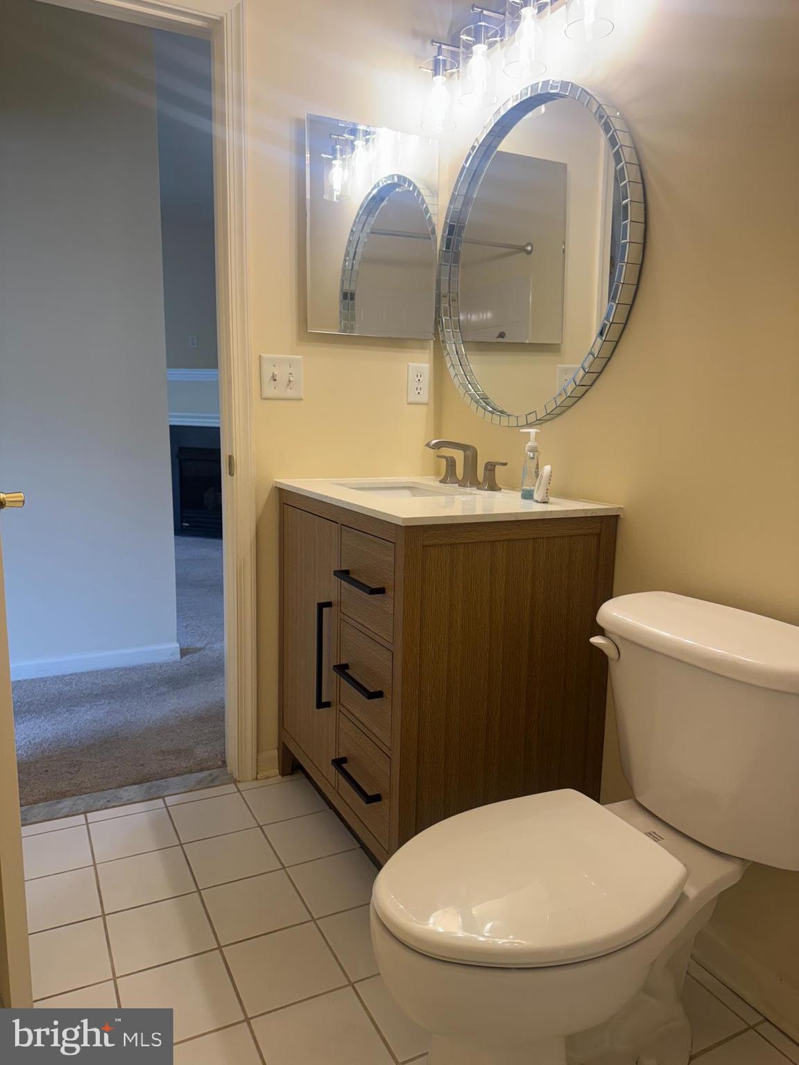 113 Kyle Way Ewing, NJ 08628 - Photo 11 of 25 a bathroom with a toilet sink and mirror