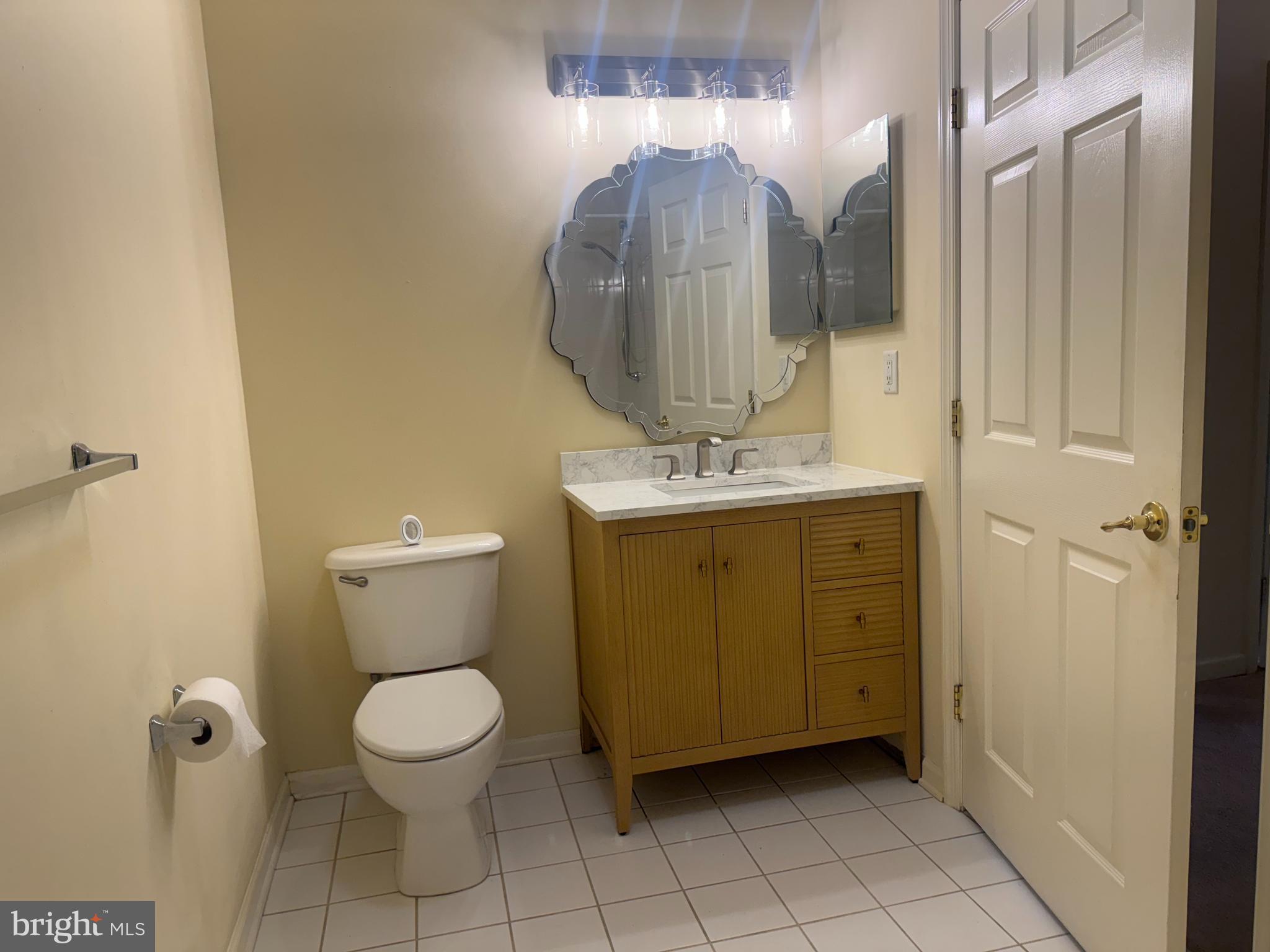 113 Kyle Way Ewing, NJ 08628 - Photo 12 of 25 a bathroom with a toilet sink and mirror