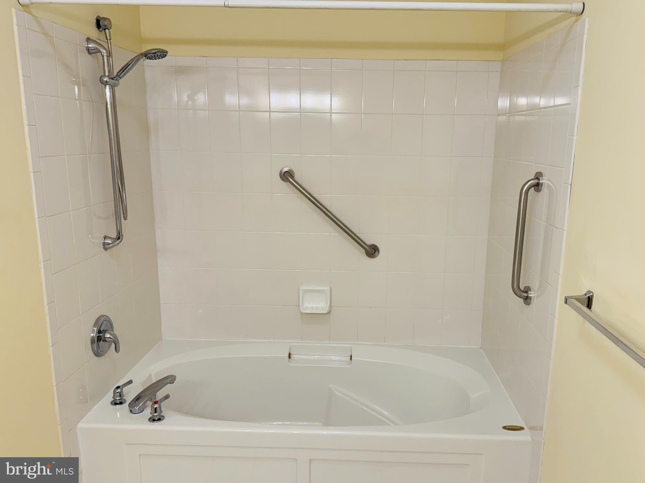 113 Kyle Way Ewing, NJ 08628 - Photo 13 of 25 a white bath tub sitting next to a shower