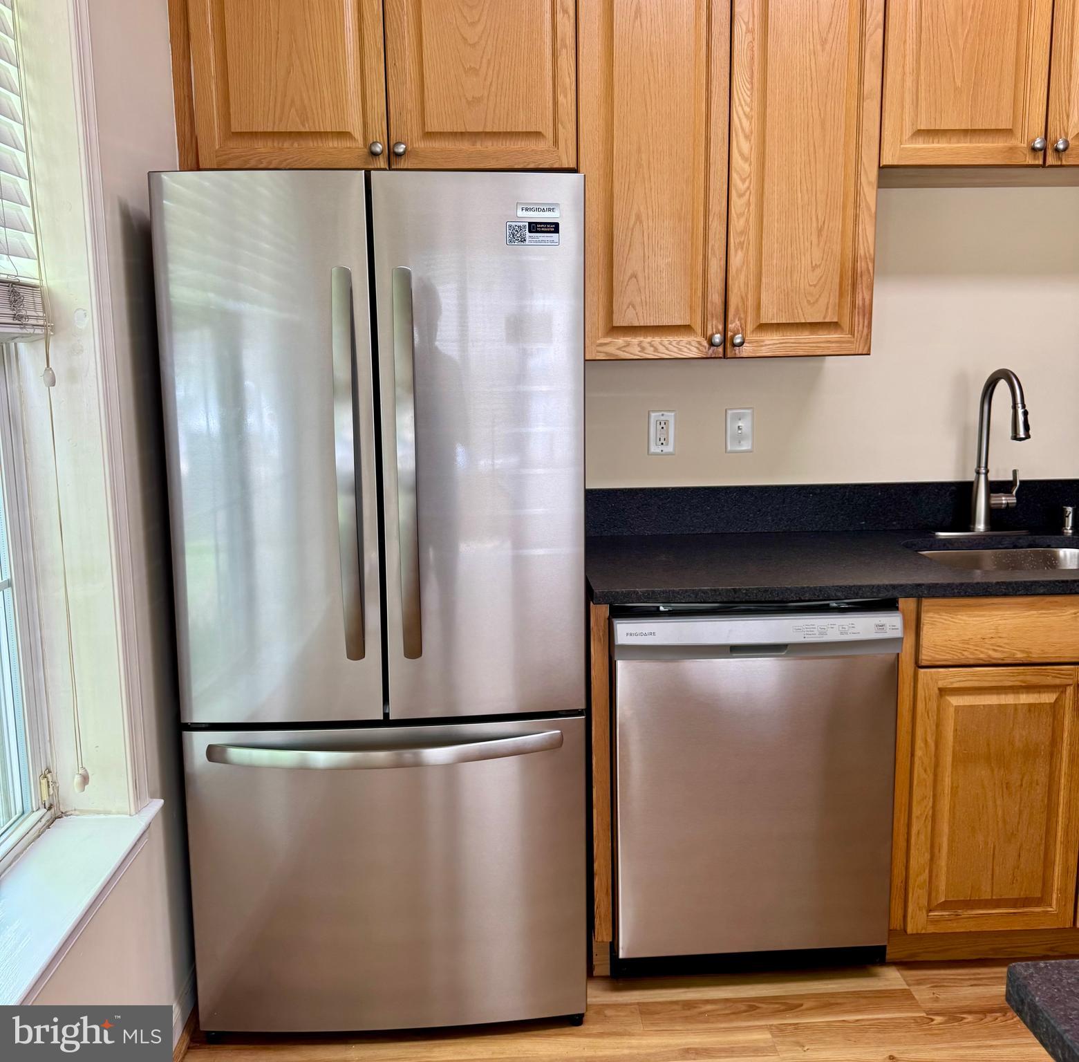 113 Kyle Way Ewing, NJ 08628 - Photo 23 of 25 a metallic refrigerator freezer sitting in a kitchen