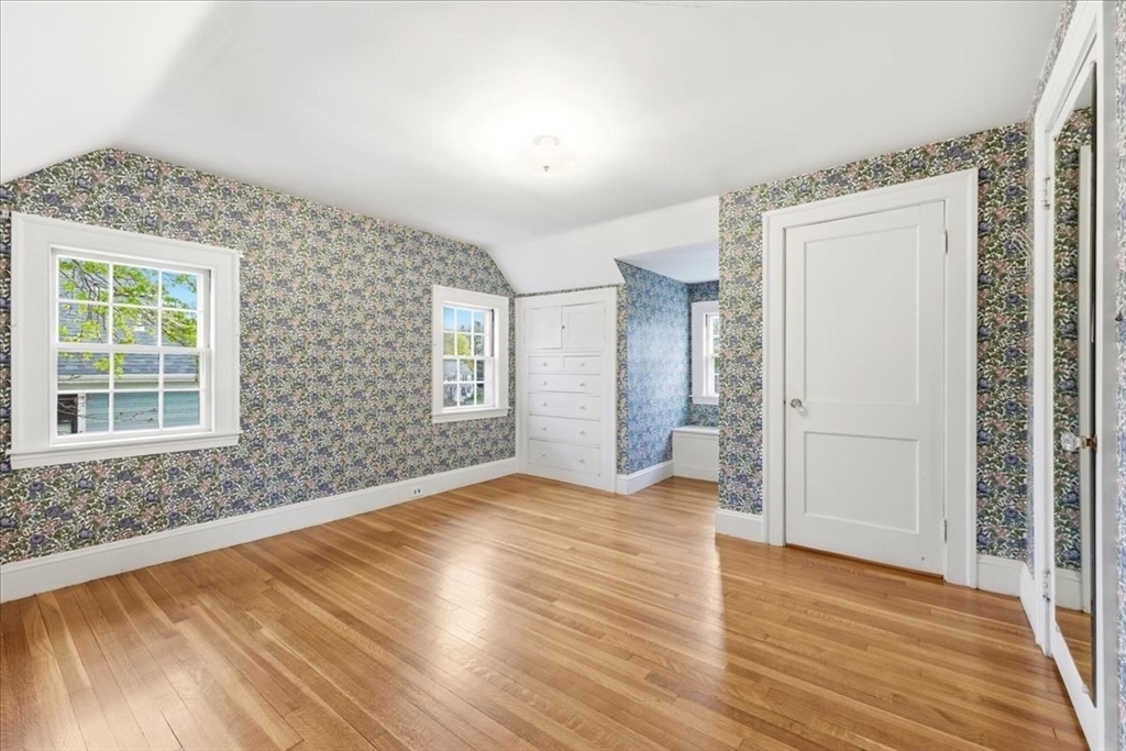 238 Harris Avenue Needham, MA 02492 - Photo 25 of 35 a view of an empty room with wooden floor and a window