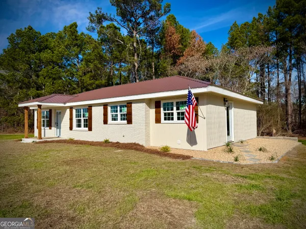 a house with trees in the background