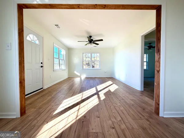 a view of entryway with wooden floor