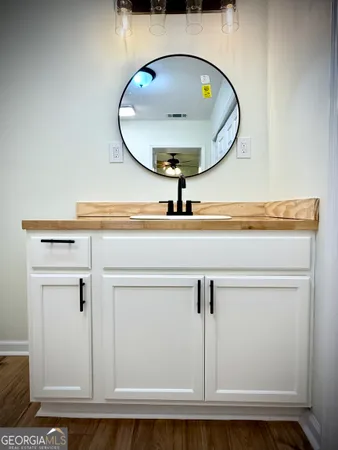 a bathroom with a sink and a mirror