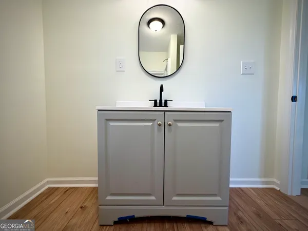a bathroom with a sink and a mirror