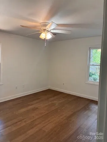 a view of fireplace and window in a room