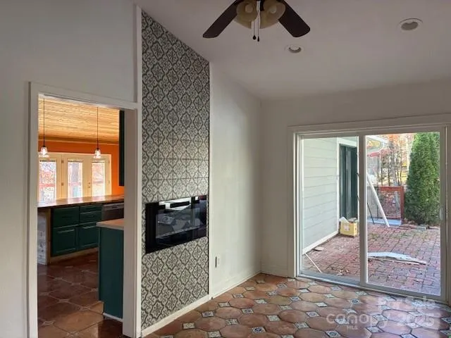 a view of a roof deck with wooden fence and floor
