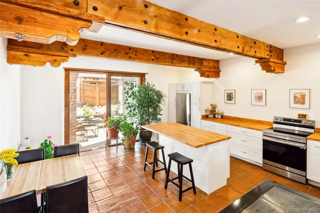 a dining room with a table and chairs
