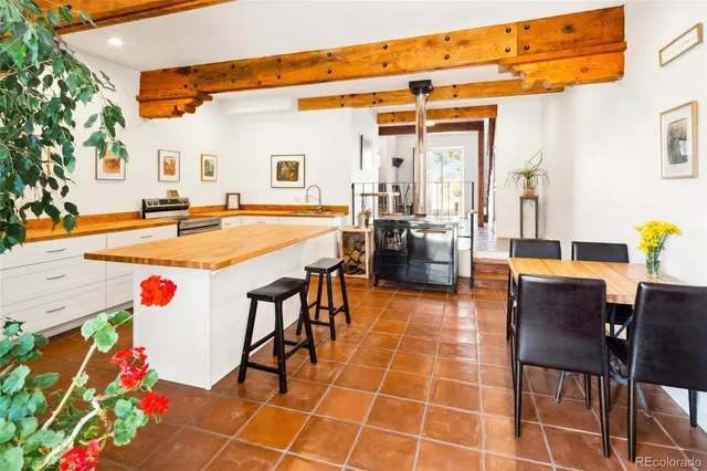 a kitchen that has a sink and a stove