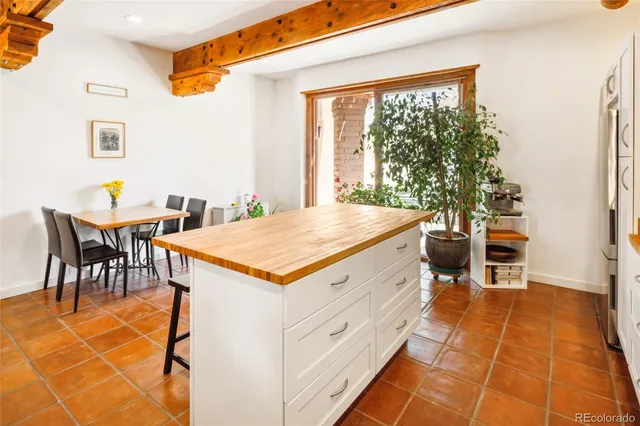 a kitchen with a refrigerator and countertop