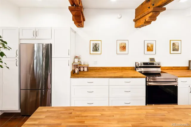a kitchen with stainless steel appliances granite countertop a stove and a sink