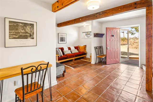 a view of a hallway with couch and furniture