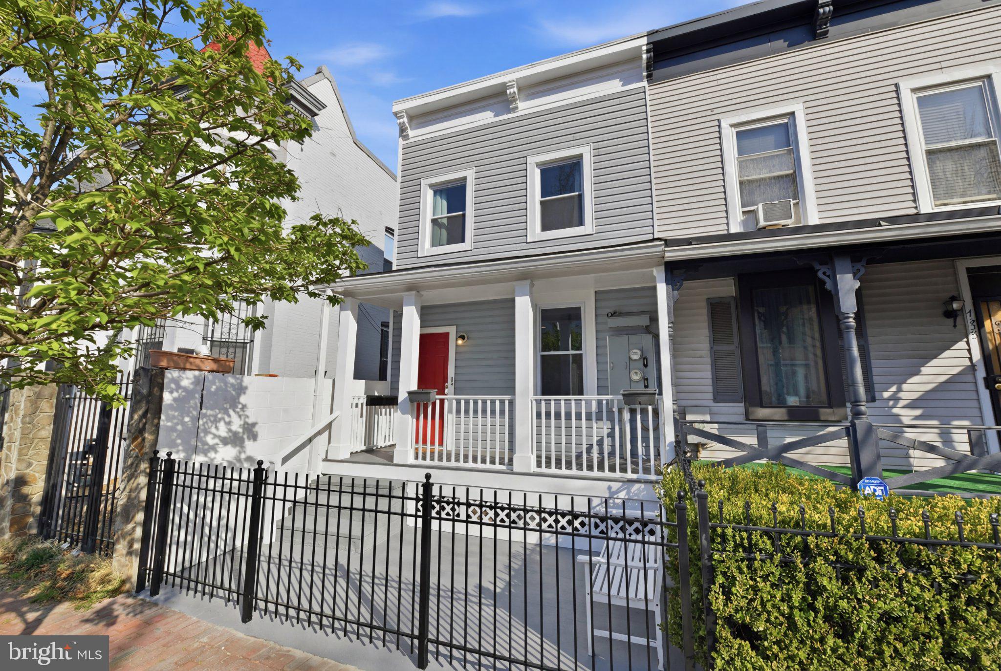 Charming townhouse with inviting porch.