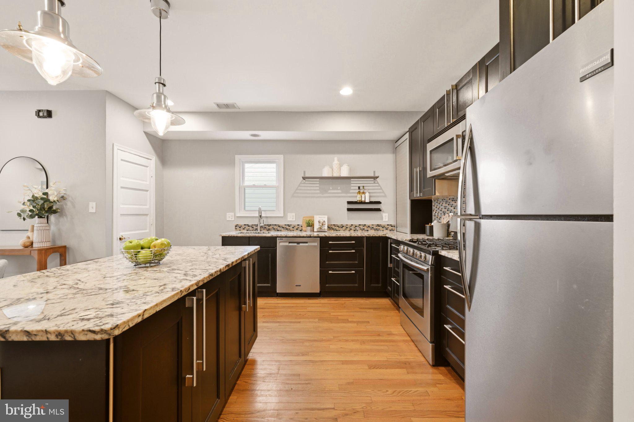 737 Morton Street Northwest Washington, DC 20010 - Photo 12 of 36 Modern kitchen with sleek finishes.