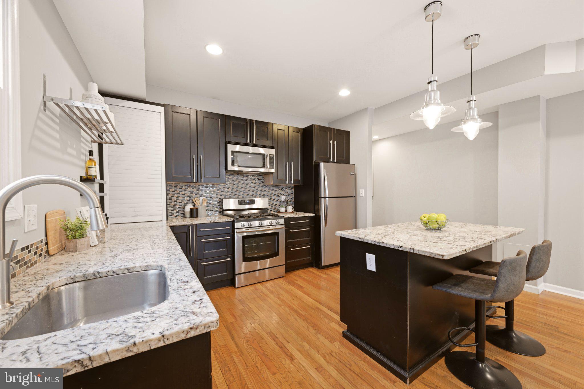 737 Morton Street Northwest Washington, DC 20010 - Photo 9 of 36 Sleek modern kitchen with elegance.