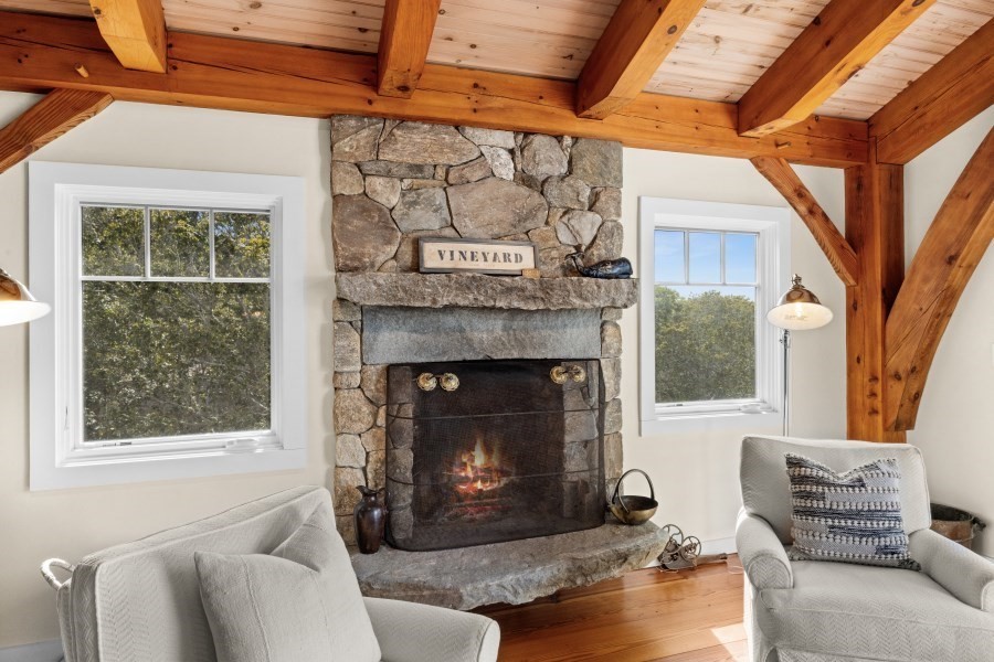 97 Longview Road West Tisbury, MA 02568 - Photo 15 of 42 a living room with furniture and a fireplace