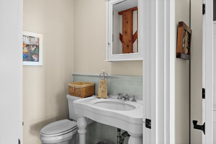 97 Longview Road West Tisbury, MA 02568 - Photo 20 of 42 a bathroom with a toilet a sink and mirror