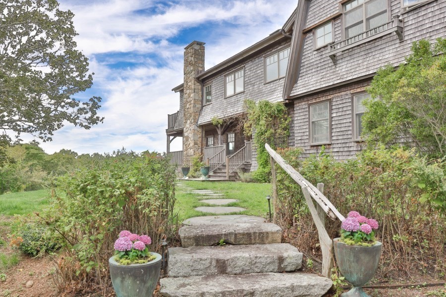 97 Longview Road West Tisbury, MA 02568 - Photo 2 of 42 a front view of a house with a garden