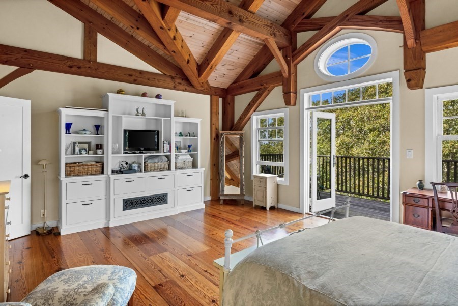 97 Longview Road West Tisbury, MA 02568 - Photo 23 of 42 a bedroom with furniture and a flat screen tv