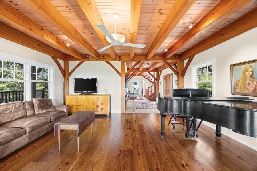 97 Longview Road West Tisbury, MA 02568 - Photo 31 of 42 a living room with furniture a wooden floor and a table