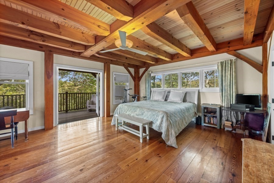 97 Longview Road West Tisbury, MA 02568 - Photo 33 of 42 a bed sitting in a spacious bedroom next to a window