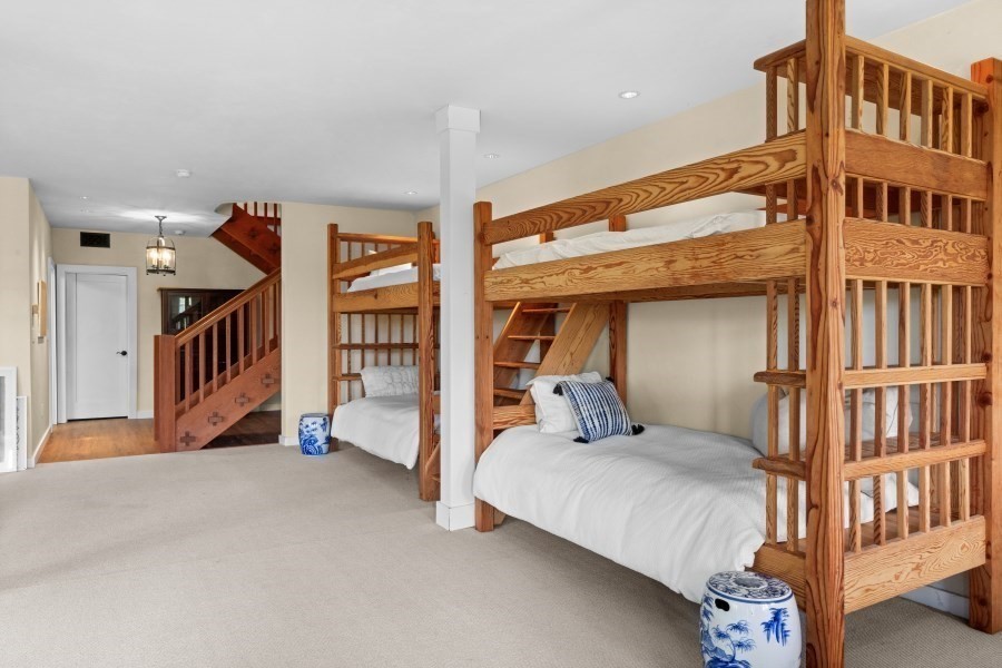 97 Longview Road West Tisbury, MA 02568 - Photo 36 of 42 a bedroom with a bed and a large window